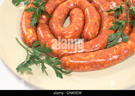 Fresh raw sausages on plate Stock Photo