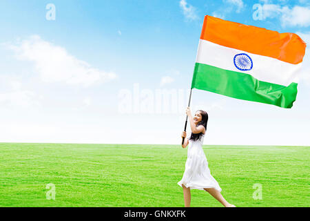 1 indian Teenagers Girl independence Day Park  Running holding flag Fluttering Stock Photo