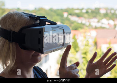 Businesswoman using virtual reality glasses Stock Photo