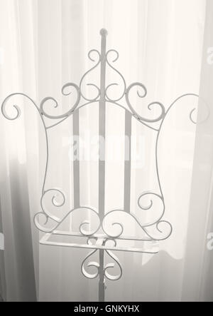 white metal hanger for clothes in the room Stock Photo