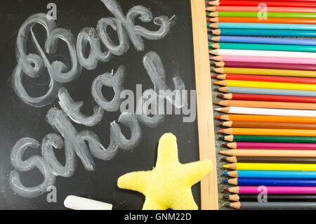 Back to school written on the blackboard Stock Photo