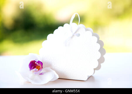 Wedding cake box with white orchid Stock Photo