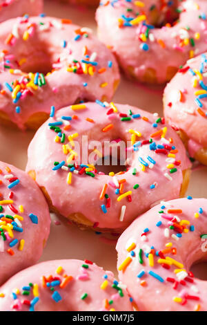 Homemade Sweet Donuts with Pink Frosting and Sprinkles Stock Photo