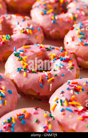 Homemade Sweet Donuts with Pink Frosting and Sprinkles Stock Photo