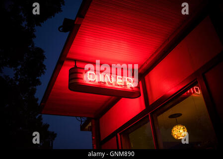 Neon Red Diner Sign at Night on a street in Athens, Georgia Stock Photo