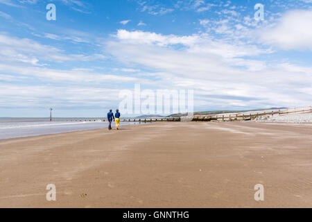 People walking on Ynyslas Beach, near Aberystwyth in Ceredigion, Wales UK Stock Photo