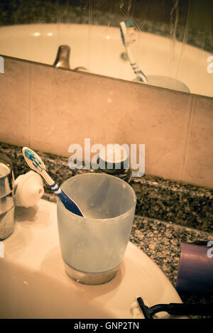 Bathroom sink in messy condition, a single male lifestyle concept Stock Photo