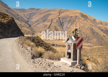 Roadside shrine at high altitude on an Andean dirt road in Salta province, Argentina Stock Photo