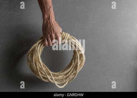 Hand holding rope business concept Stock Photo