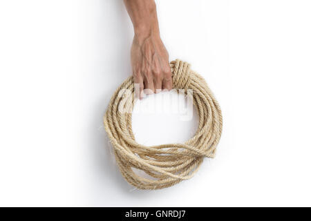 Hand holding ship rope isolated on white Stock Photo