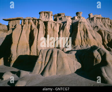 USA, North Dakota, Theodore Roosevelt National Park, Pedestals or rain pillars with hard sandstone cap rocks atop softer clay. Stock Photo