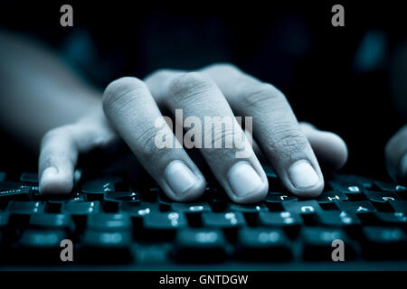 Human hand on keyboard,isolated, selective focus, shallow depth of field, concept of work & technology. Stock Photo