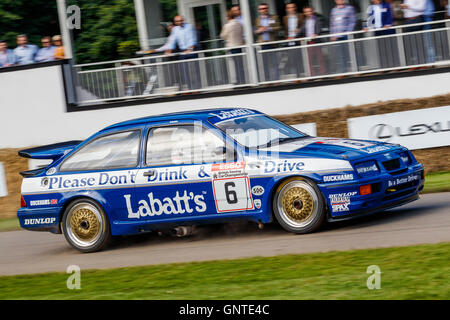 1989 Ford Sierra Cosworth RS500 with driver Paul Smith at the 2016 Goodwood Festival of Speed, Sussex, UK. Stock Photo