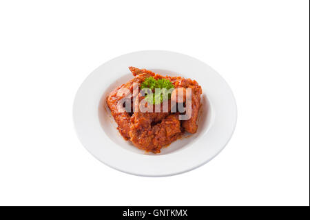 Front view of Korean style deep fried chicken wings mix with spicy barbecue sauce in ceramic dish isolated on white background Stock Photo