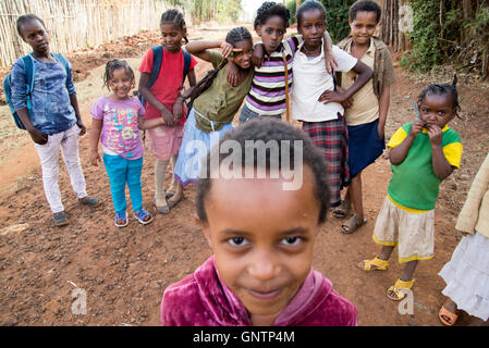 I teacher and running coach at a girls school in rural Southern Ethiopia makes his bed before heading off to work. Stock Photo