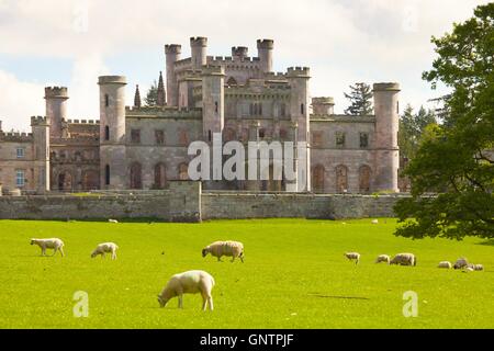 Lowther Castle ruins. Lowther Castle ruins. Sheep grazing in park land in front of ruin. Lowther, Askham, Penrith, Cumbria, UK. Stock Photo