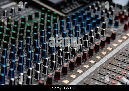 Close up view of sound mixing console. Selective focus. Stock Photo