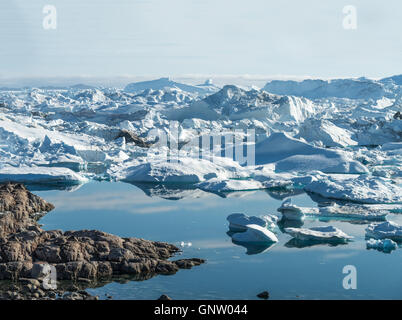 Stranded icebergs at the mouth of the Icefjord near Ilulissat, Greenland Stock Photo