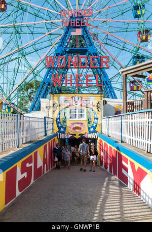 Entrance to Coney Island amusement park and the Wonder Wheel, with graffiti art mural on the walls of the underpass. Stock Photo