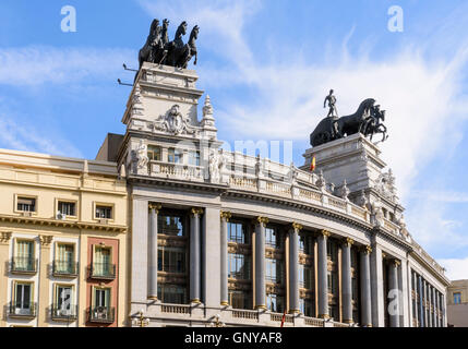 Four horse chariot sculpture on top of the BBVA building in Madrid, Spain Stock Photo