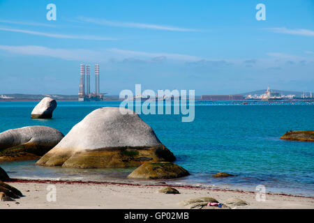 Rocks on the beach at Saldanha Bay on the West Coast of South Africa, the largest iron ore export facility in Africa transporting from Sishen. Stock Photo