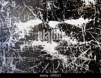 Scratched grungy black and silver surface background texture Stock Photo