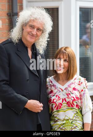 Queen guitarist Brian May with Kashmira Cooke, sister of Freddie Mercury, at the unveiling of an English Heritage blue plaque to the band's lead singer at his former home at 22 Gladstone Avenue in Feltham, west London. Stock Photo