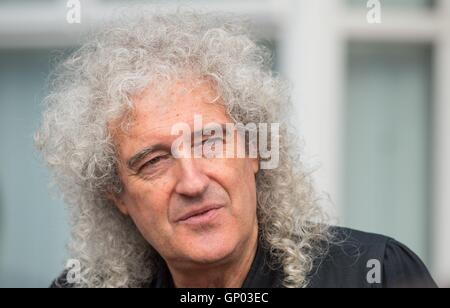 Queen guitarist Brian May at the unveiling of an English Heritage blue plaque to the band's lead singer, Freddie Mercury, at his former home at 22 Gladstone Avenue in Feltham, west London. Stock Photo