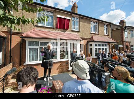 Queen guitarist Brian May speaks at the unveiling of an English Heritage blue plaque to the band's lead singer, Freddie Mercury, at his former home at 22 Gladstone Avenue in Feltham, west London. Stock Photo