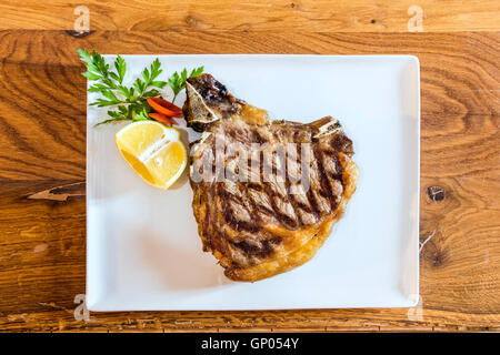 Bistecca alla Fiorentina made of Chianina beef is the most typical and traditional dish in Florence and Tuscany Stock Photo