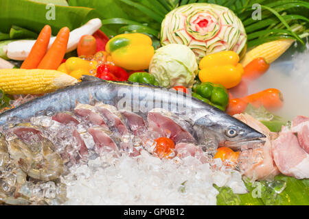 Fresh seafood showcases with vegetables carving decorations in a luxury restaurant. Stock Photo