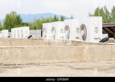 Air compressors machine on roof of industrial building Stock Photo