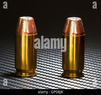 Hollow point bullets on top of cartridges for a forty five caliber handgun Stock Photo