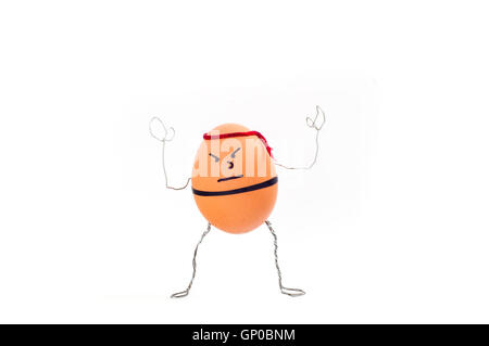 Karate chicken egg shell person with angry face and red rope on head. Stock Photo