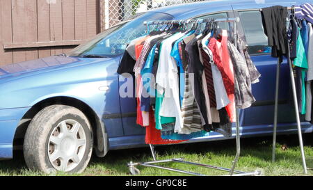 Clothes for sale at flea market in Avondale, Auckland, New Zealand Stock Photo