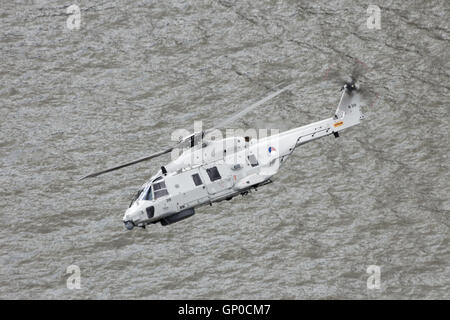 Royal Netherlands Navy NH90 helicopter flying over the Meuse river. Stock Photo