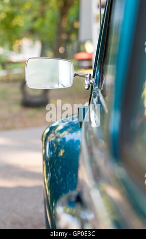 Metal rear mirror of an old car Stock Photo