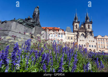 Prague flowers in flowerbed Sculpture of Jan Hus John Huss Memorial on Old Town Square, Prague, Czech Republic Stock Photo