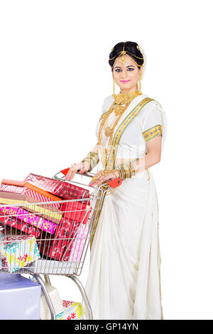 1 Beautiful Adult Bride Malayalee Woman Diwali Cart Trolley Abundance gift shopping Stock Photo