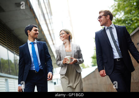 Young office workers having conversation outdoors Stock Photo