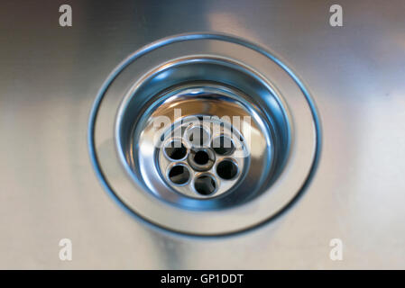 close up of a stainless steel sink plug hole Stock Photo