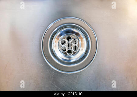 close up of a stainless steel sink plug hole Stock Photo