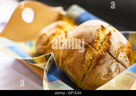 Freshly Baked Traditional Corn Bread in Wooden Basket. Fresh Corn Buns Closeup Selective Focus. Stock Photo