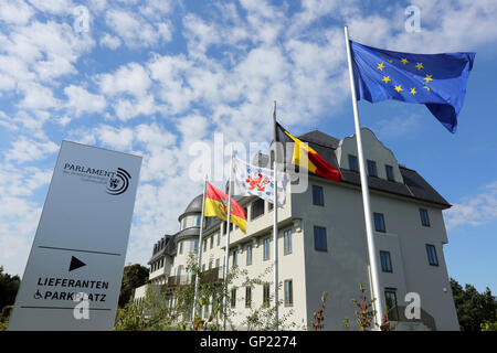 Parliament building of the German speaking Community in Eupen, Belgium. Flags from left to right: City of Eupen, German-speaking Community, Belgium, Europe Stock Photo