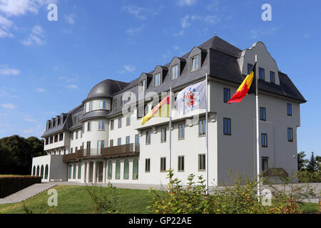 Parliament building of the German speaking Community in Eupen, Belgium. Flags from left to right: City of Eupen, German-speaking Community, Belgium, Europe Stock Photo