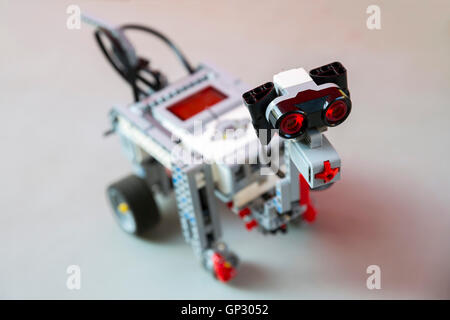 Toy robot made from toy plastic colorful blocks. Dog toy. Stock Photo