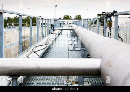 Wastewater treatment plant pipes. Water pumping station. Wastewater treatment is a process used to convert dirty wastewater into Stock Photo