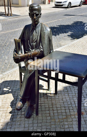 Bronze sculpture of popular poet António Aleixo (1899-1949) outside cafe he used to visit, Loulé, Portugal Stock Photo