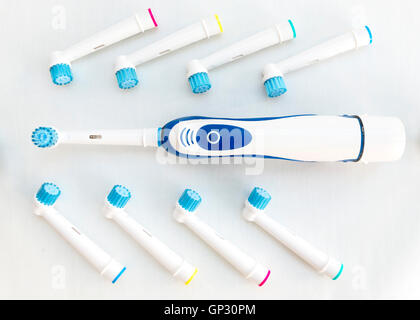 Electronic toothbrush with toothbrush heads isolated on a white background. Stock Photo