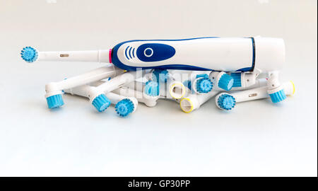 Electronic toothbrush with toothbrush heads isolated on a white background. Stock Photo